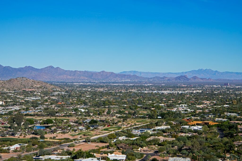 Aerial view of Phoenix, Arizona with mountains, representing the state's lack of a real estate transfer tax