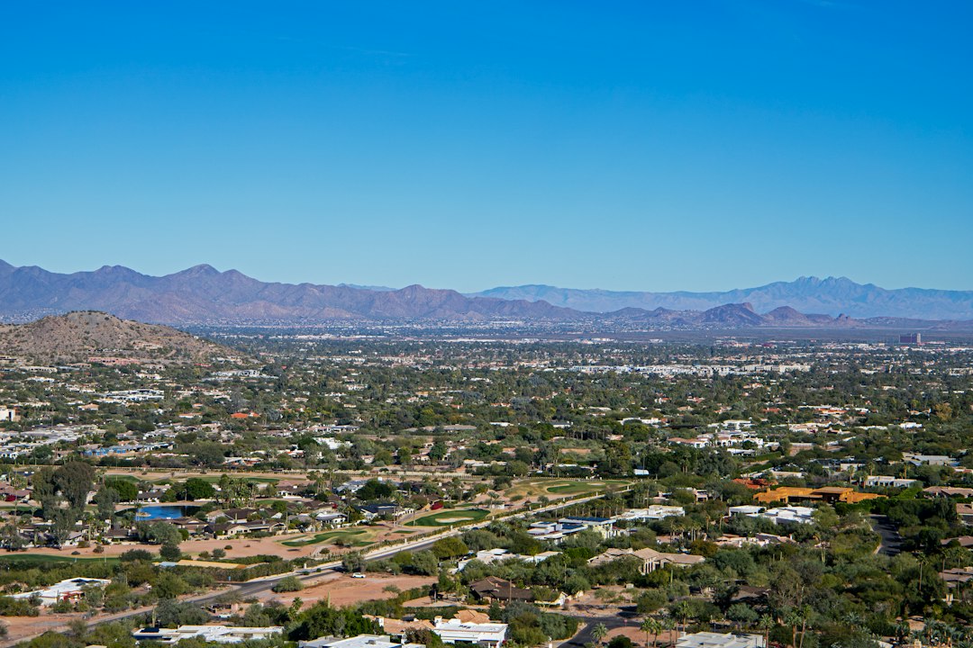 Aerial view of Phoenix, Arizona with mountains, representing the state's lack of a real estate transfer tax