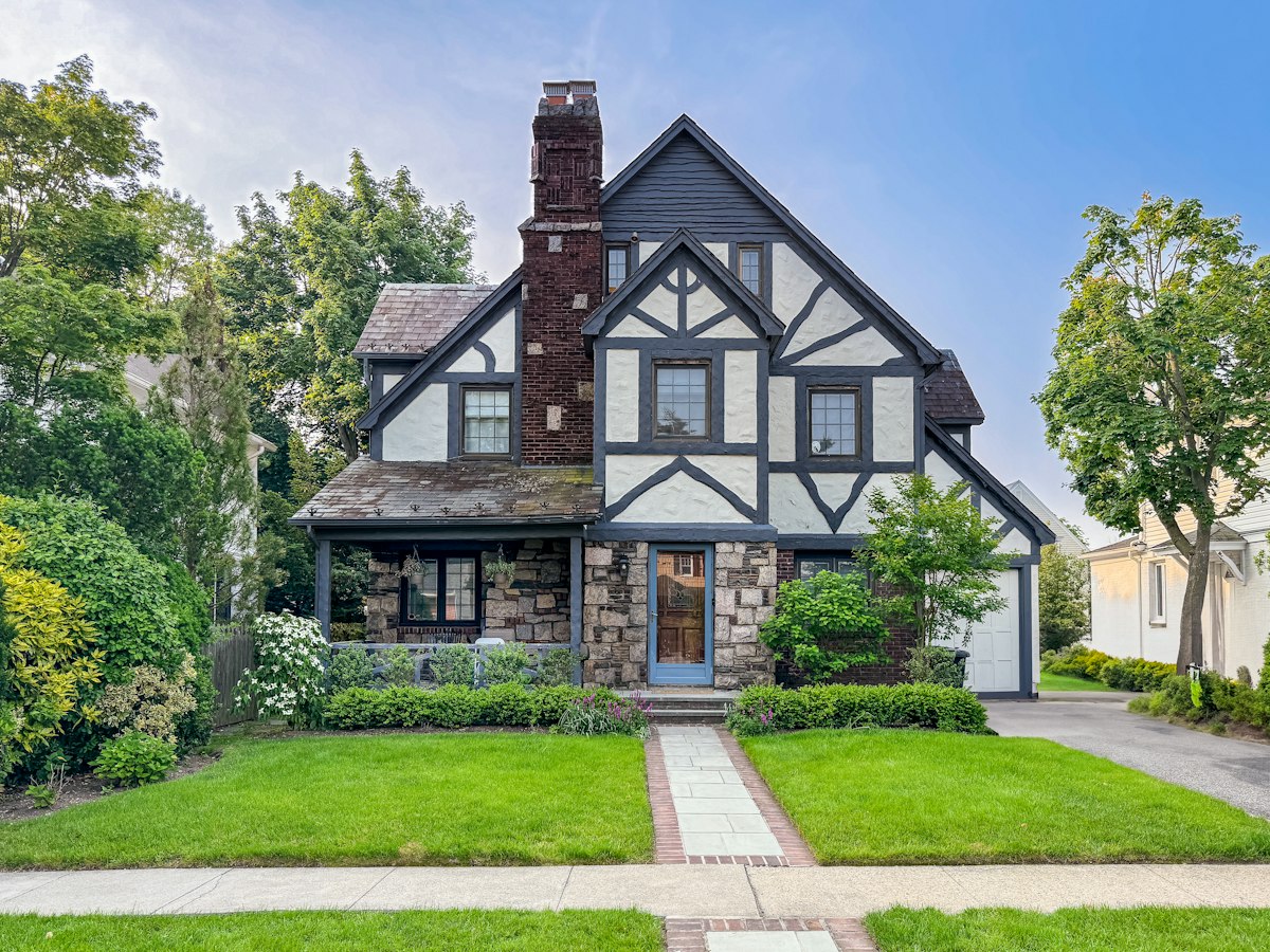 Stone and timber Tudor-style home representing a Delaware homeowner facing foreclosure in 2026