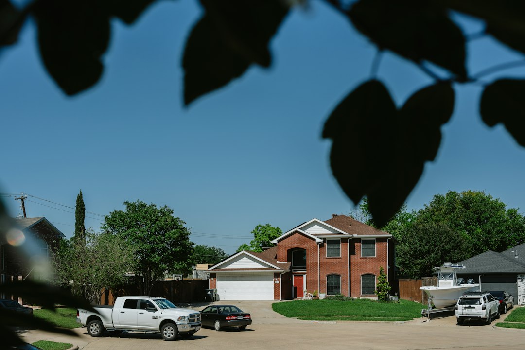 Brick house with cars in the driveway representing an Indiana homeowner facing foreclosure in 2026
