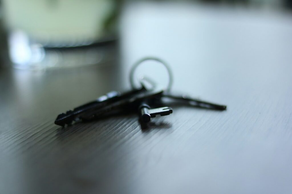House keys resting on a table representing an heir deciding what to do with an inherited Maryland home